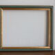 Frame in gilded and green wood
