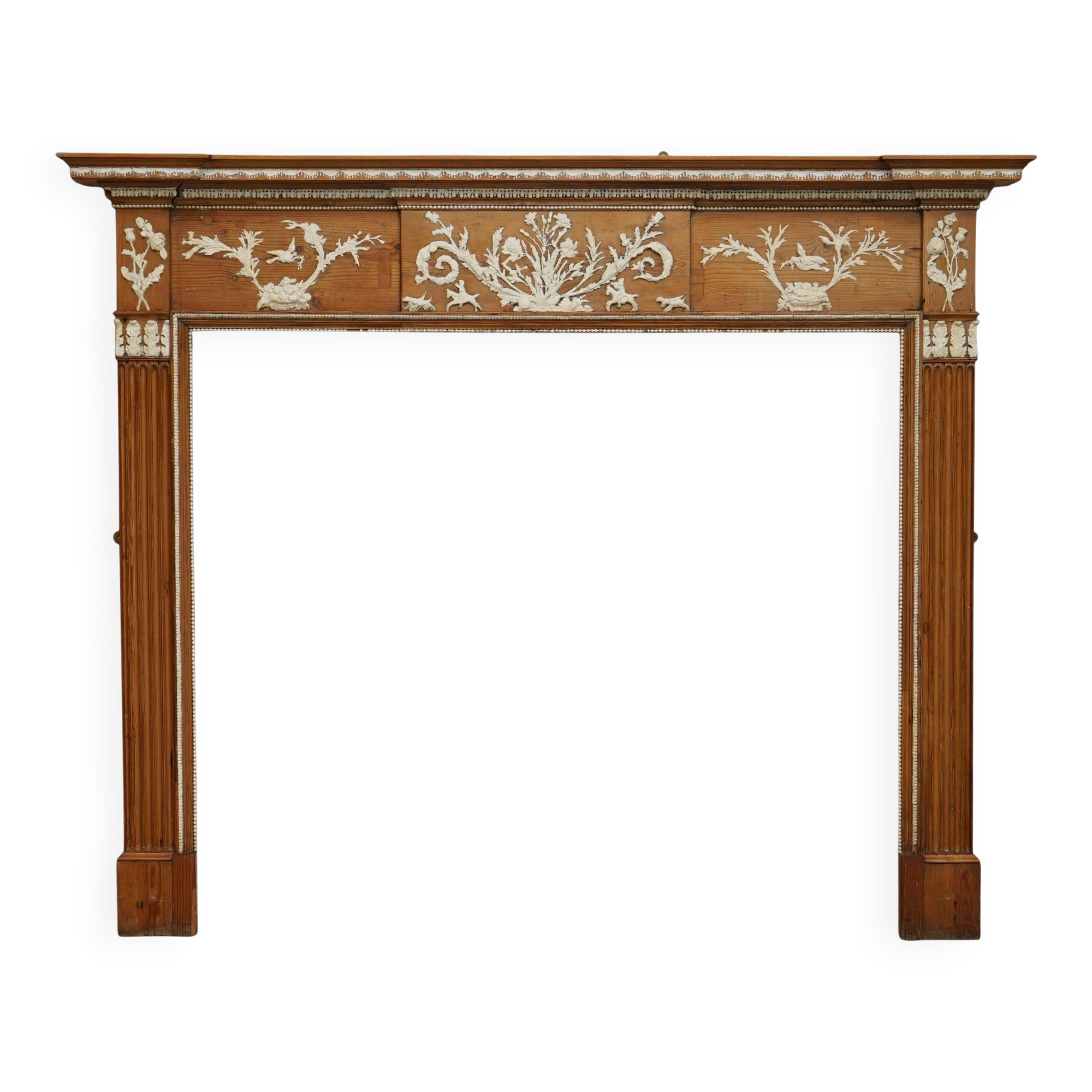 Victorian antique fireplace in tarred pine and sculpted gesso.