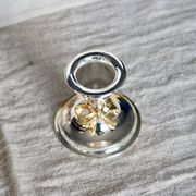 Small vintage silver-plated metal candlestick with a gold bow