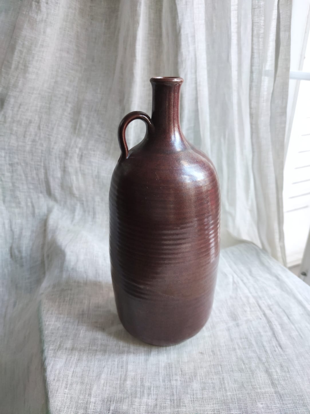 Large burgundy jar