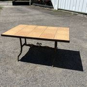 Vintage garden table with ceramic tile top and wrought iron base