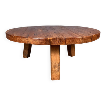 Brutalist oak coffee table with three legs.