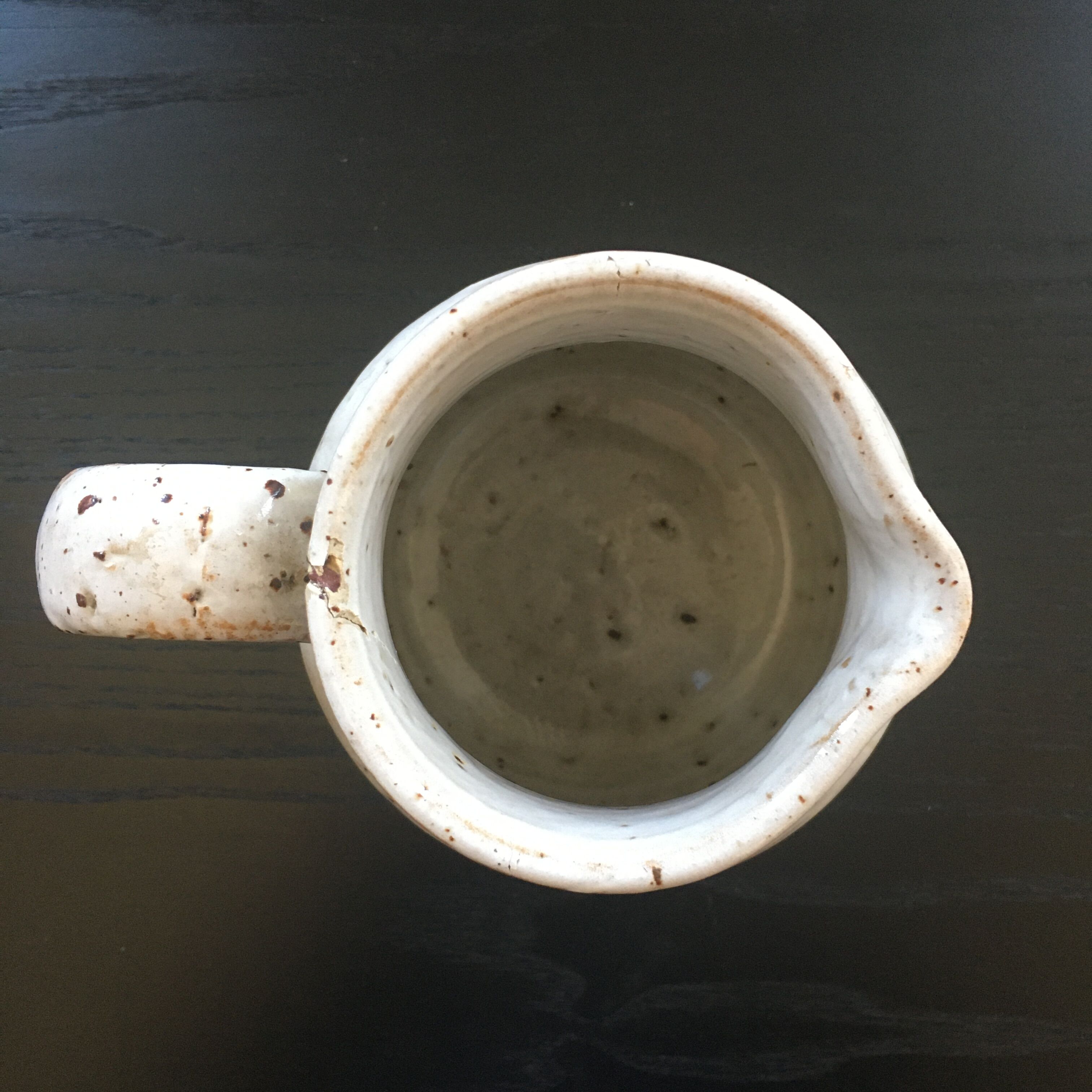 Old ivory stoneware jug