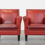 Set of 2 red-colored design armchairs made of sheepskin leather