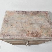 Small chest of drawers with pigments