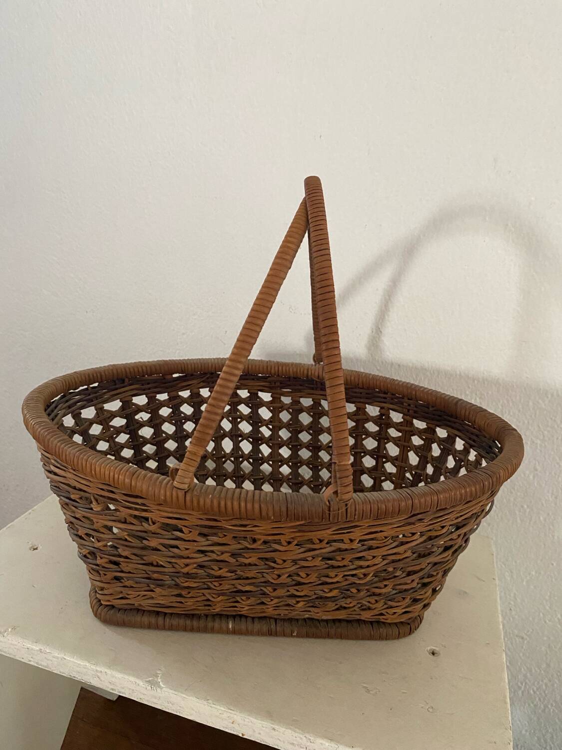 Vintage wicker and cane basket in bohemian style