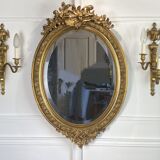Mirror / oval ice Napoleon III period in wood and gilded stucco louis xv style