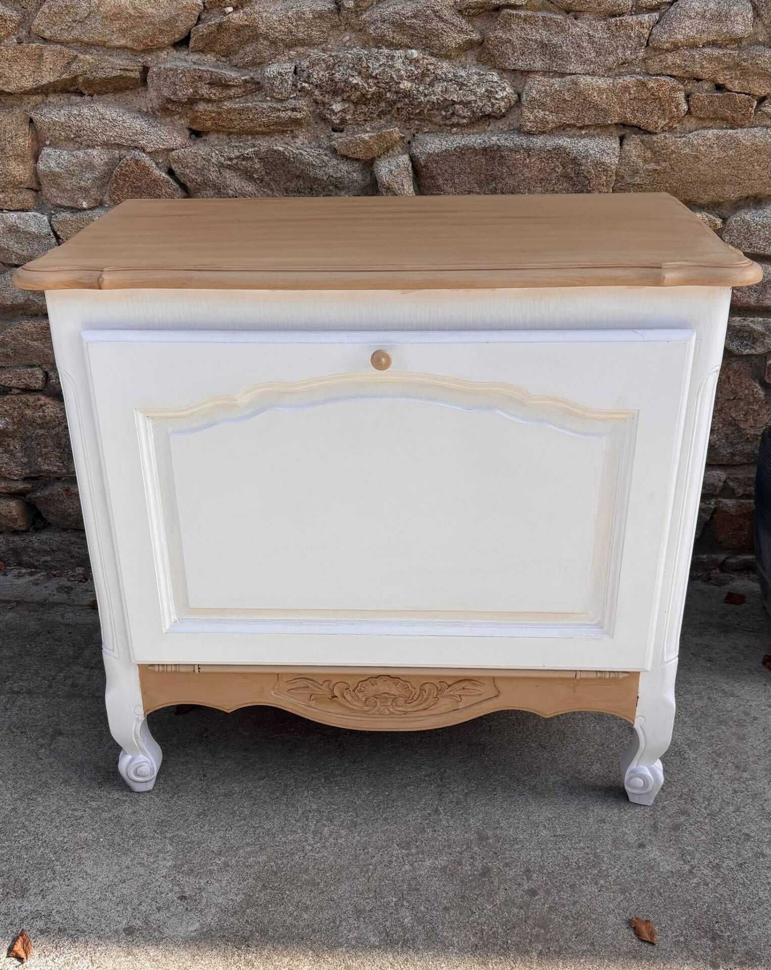 Renovated vintage furniture in raw wood and white.