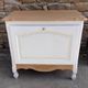 Renovated vintage furniture in raw wood and white.