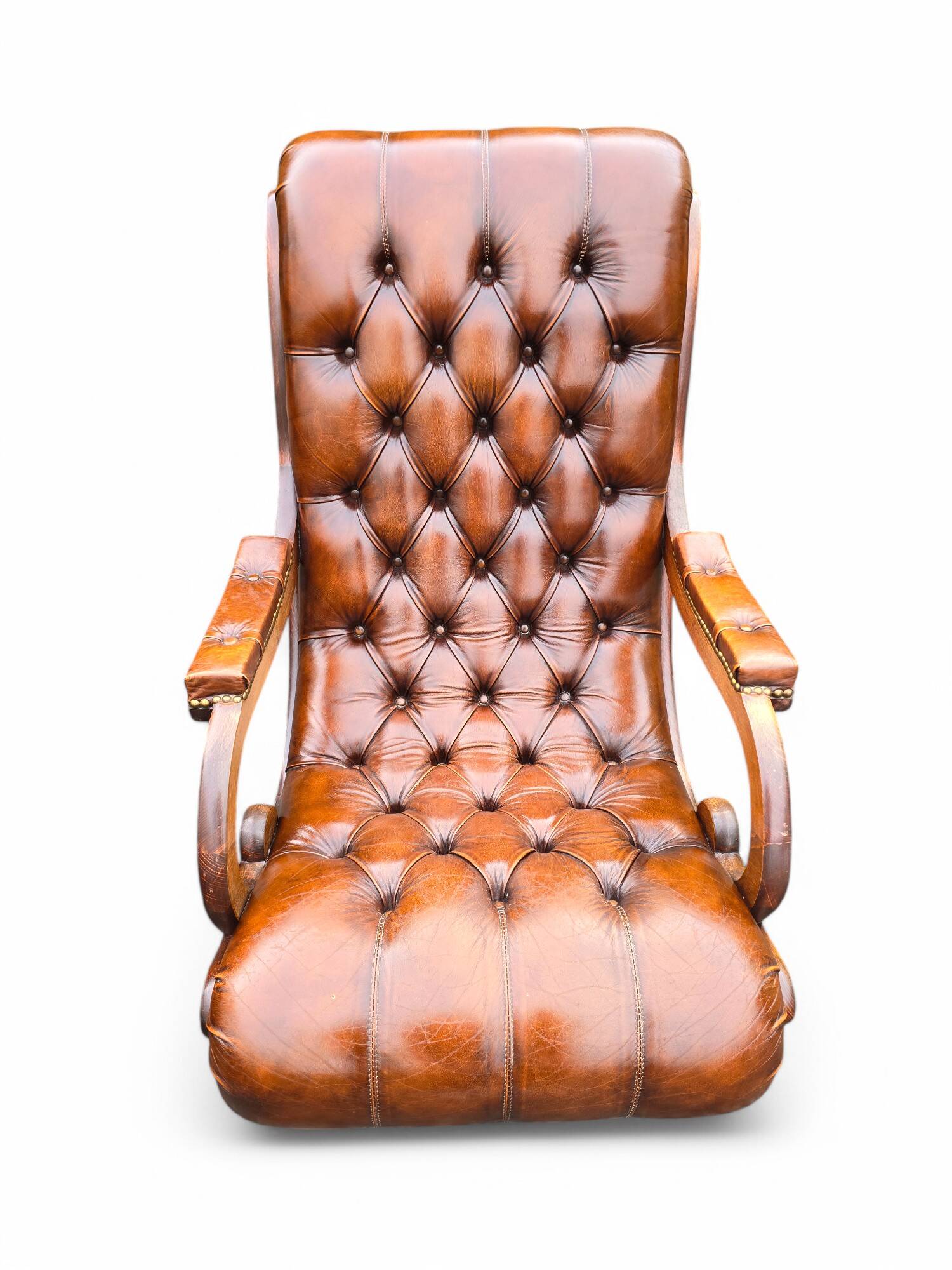 Pair of leather Chesterfields and footstools