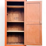 Old terracotta-colored bonnet maker