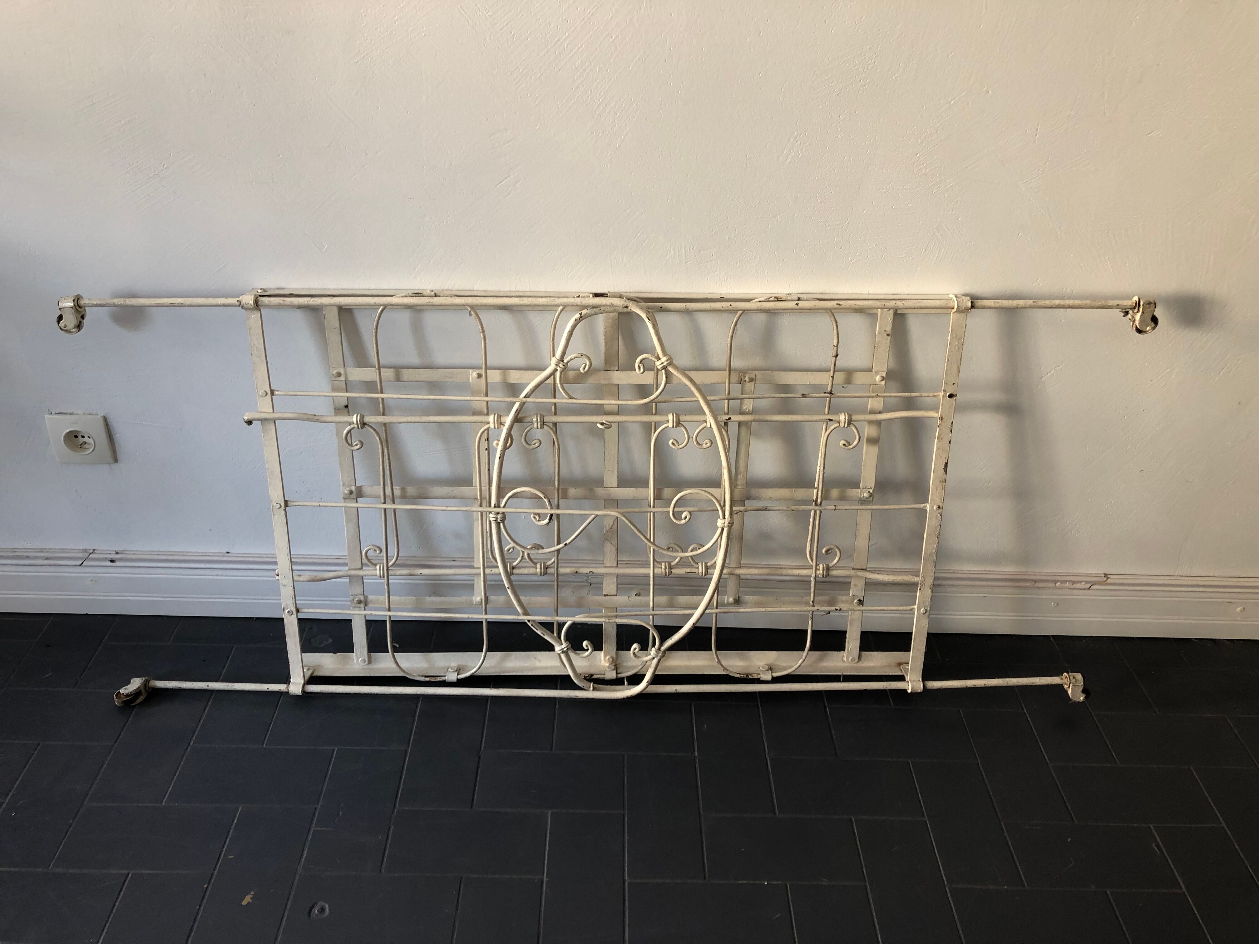 Old white wrought iron folding bed / seat