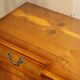 Vintage buffet made of mottled yew wood with three doors and four drawers.