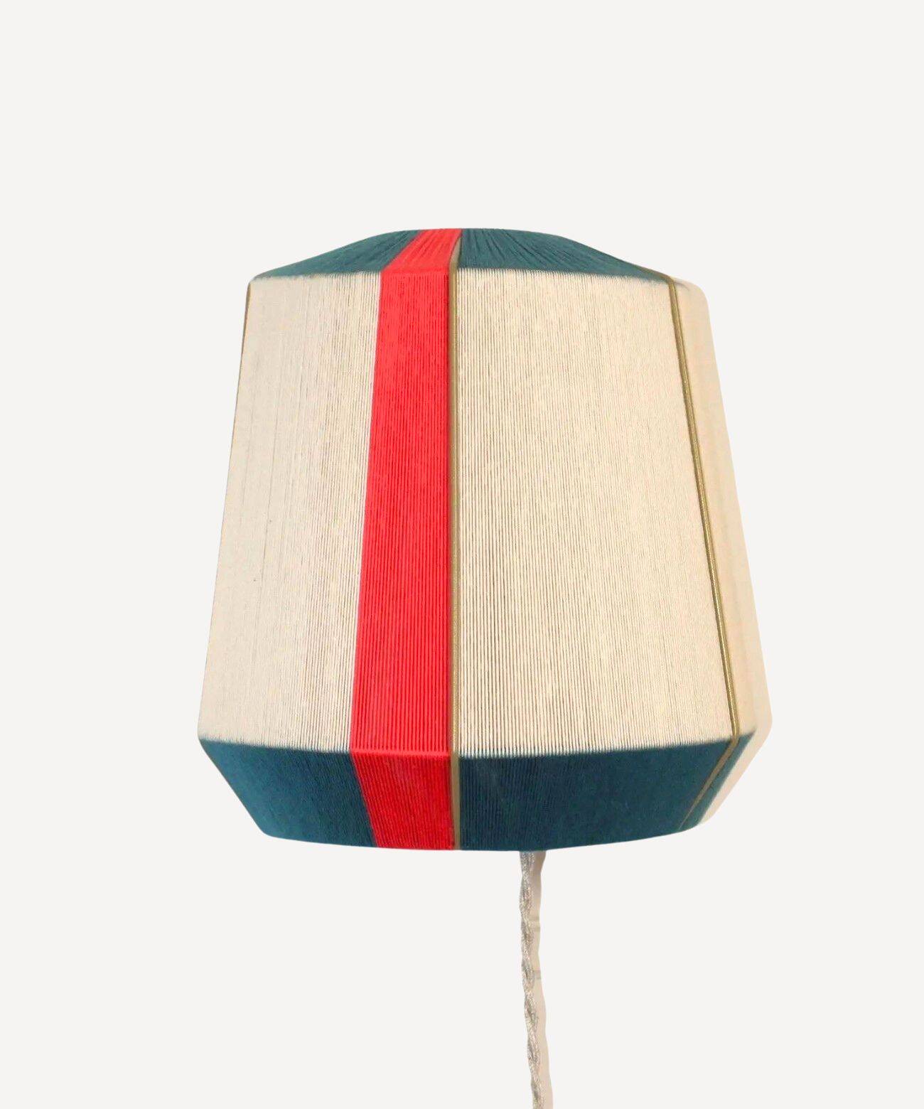 The Epicurienne coral peacock wall light