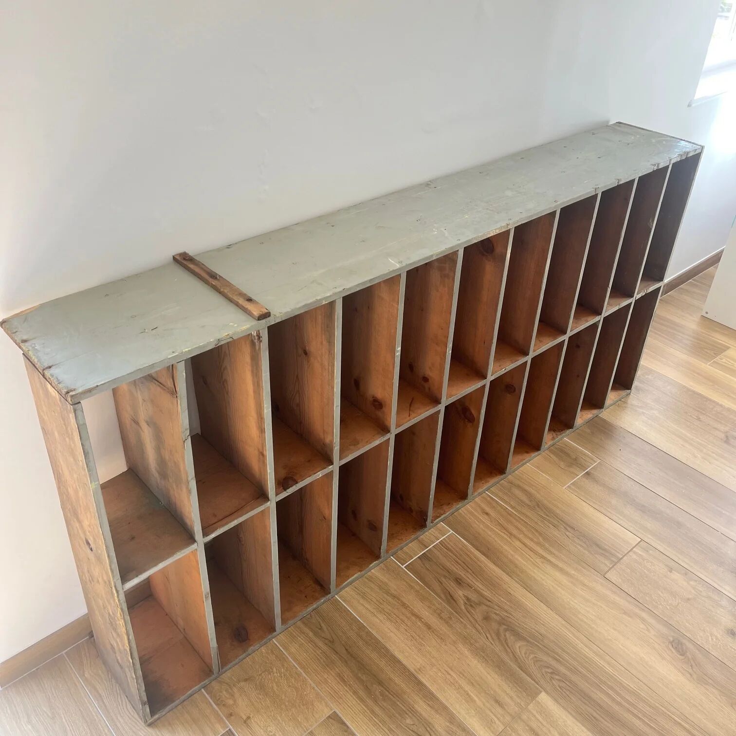 Large antique workshop cabinet with patinated wooden compartments, 20th century.