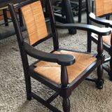 Pair of vintage 1950s Neo-Basque oak armchairs with straw seats and backs.