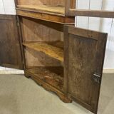 19th-century English corner cabinet in oak, mahogany, and fir.