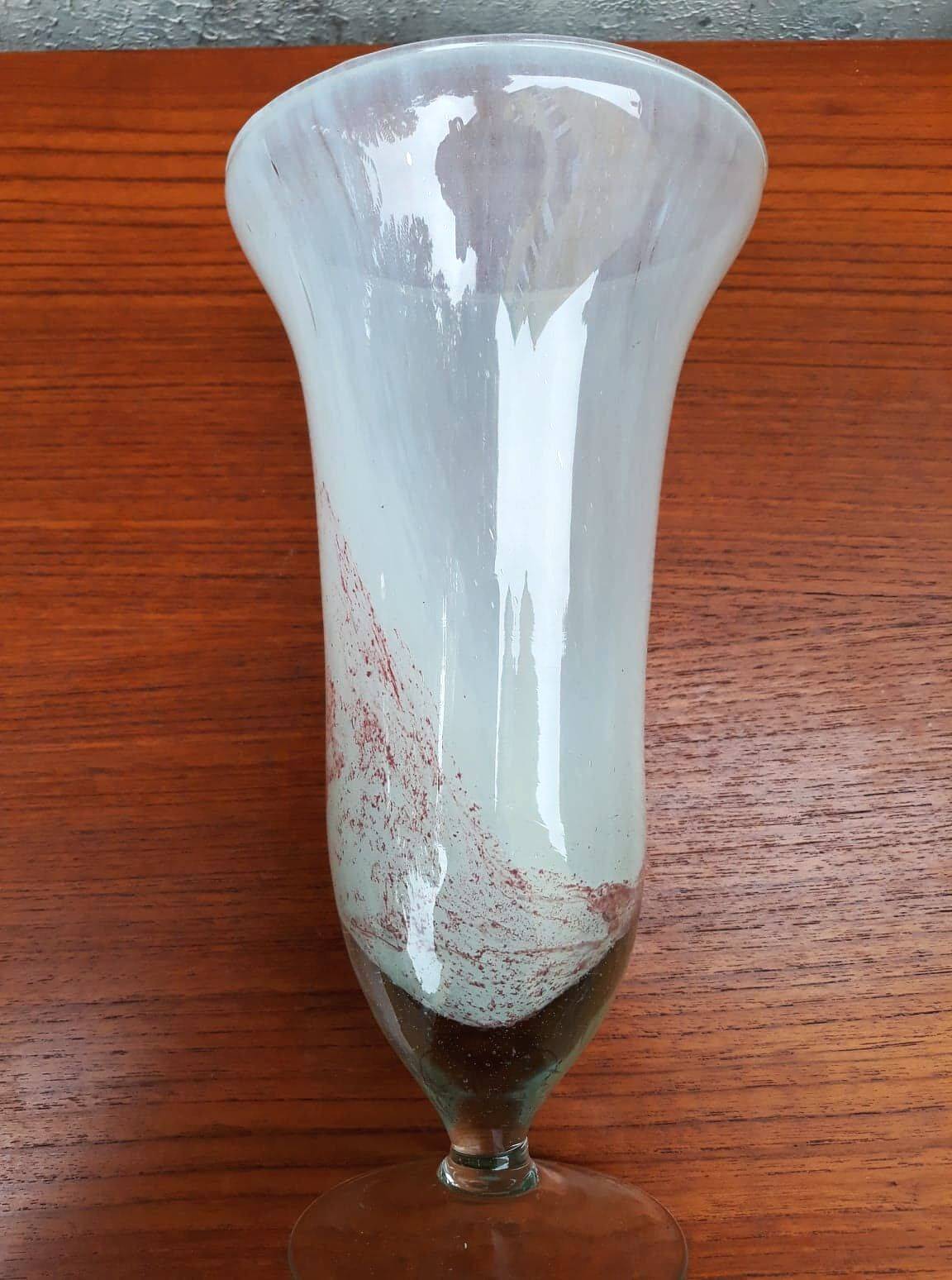 Trumpet vase on a stand in blown glass.