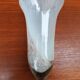 Trumpet vase on a stand in blown glass.