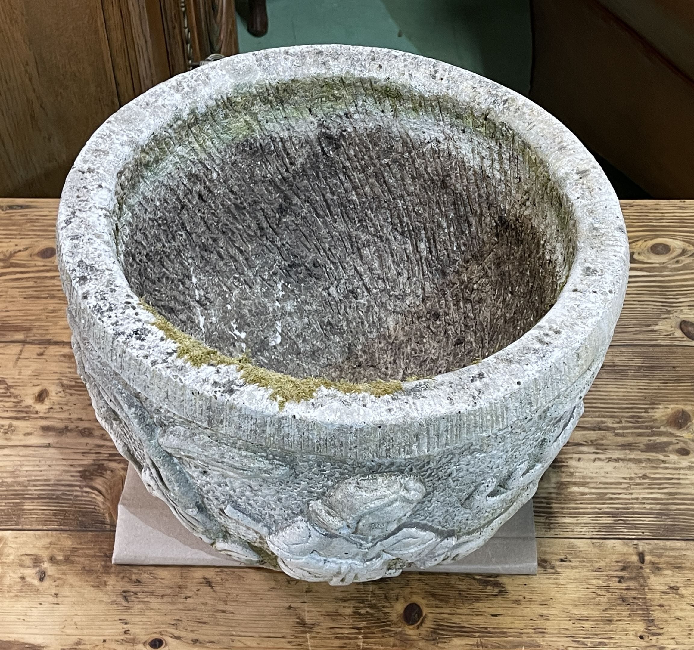 Reconstituted stone planter with hunting decoration