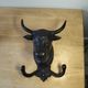 Wall-mounted coat hook in cast iron, bull's head and Camargue cross