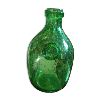 Old bottle made of bubbled blown glass biot