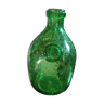 Old bottle made of bubbled blown glass biot