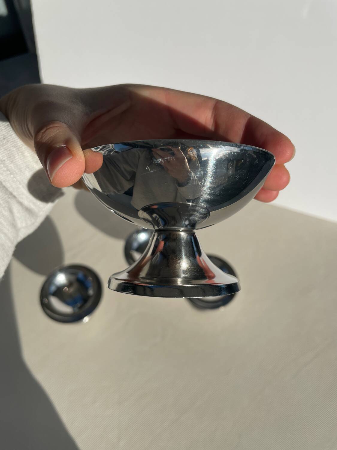 Set of 4 metal glasses / vintage stainless steel ice cream cups on a stand.