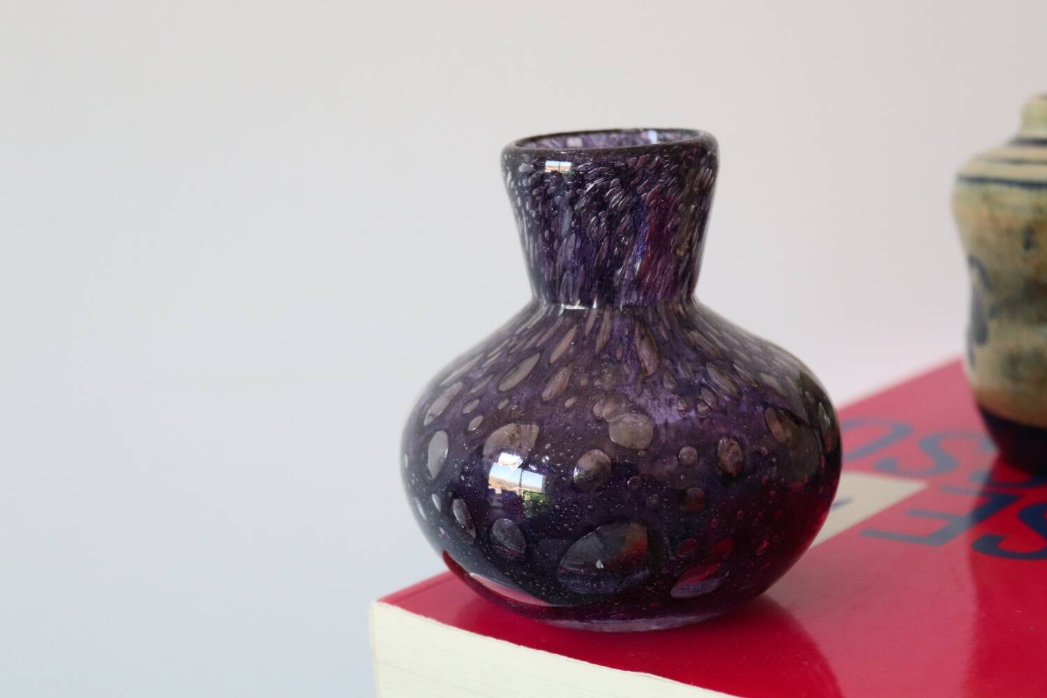 Small purple bubbled and blown glass vase