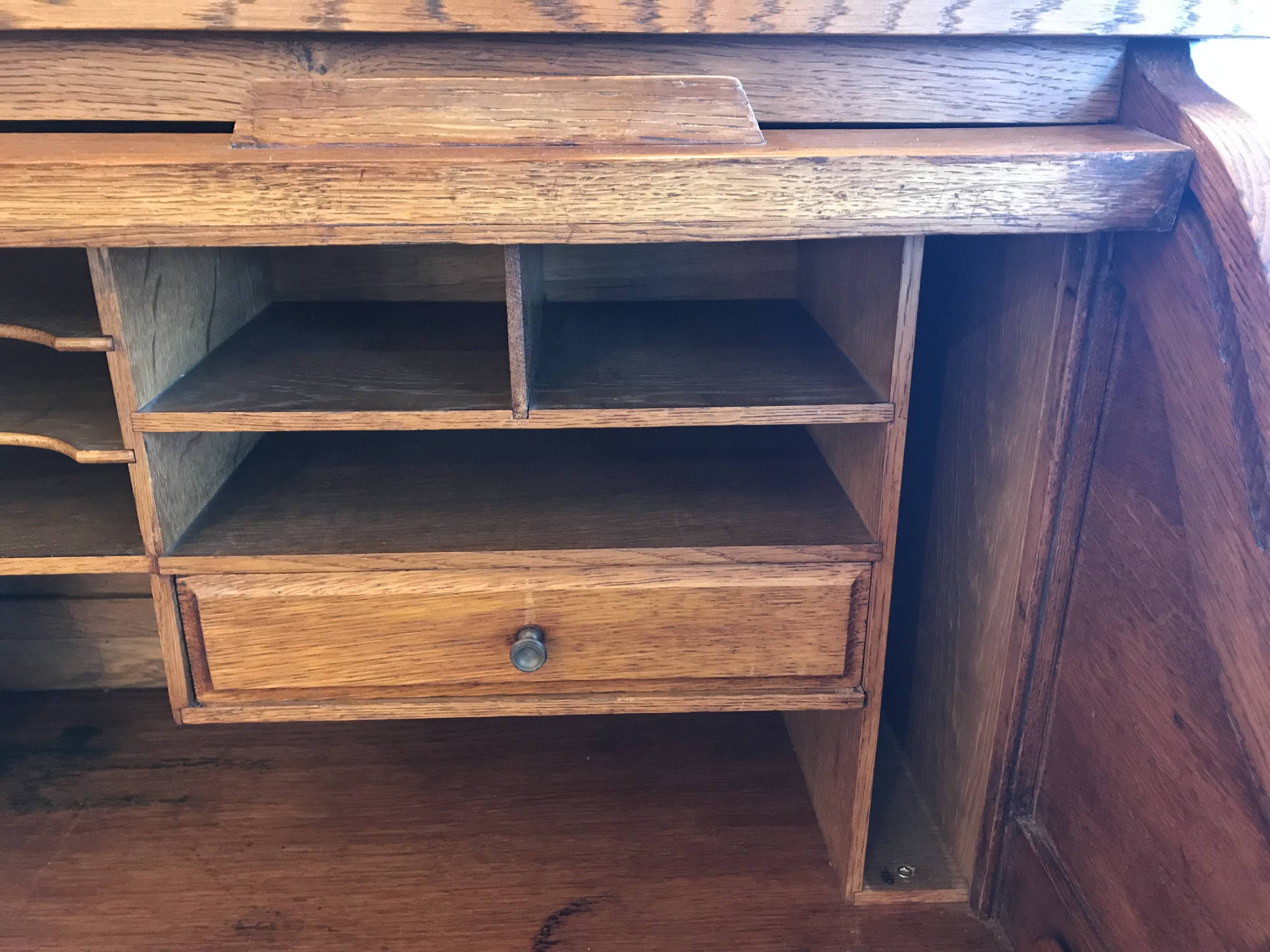 American desk with sliding shutter in solid oak, 20th century