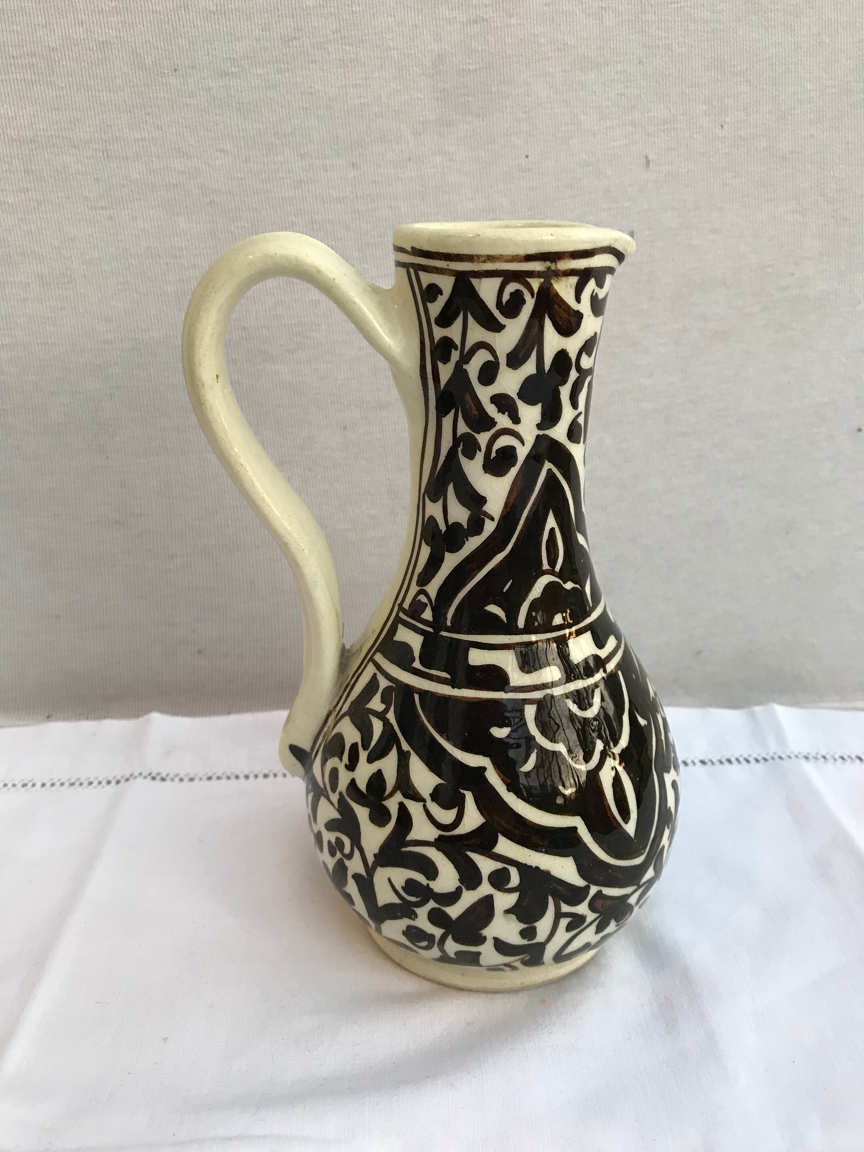 Former beige cracked ceramic pitcher