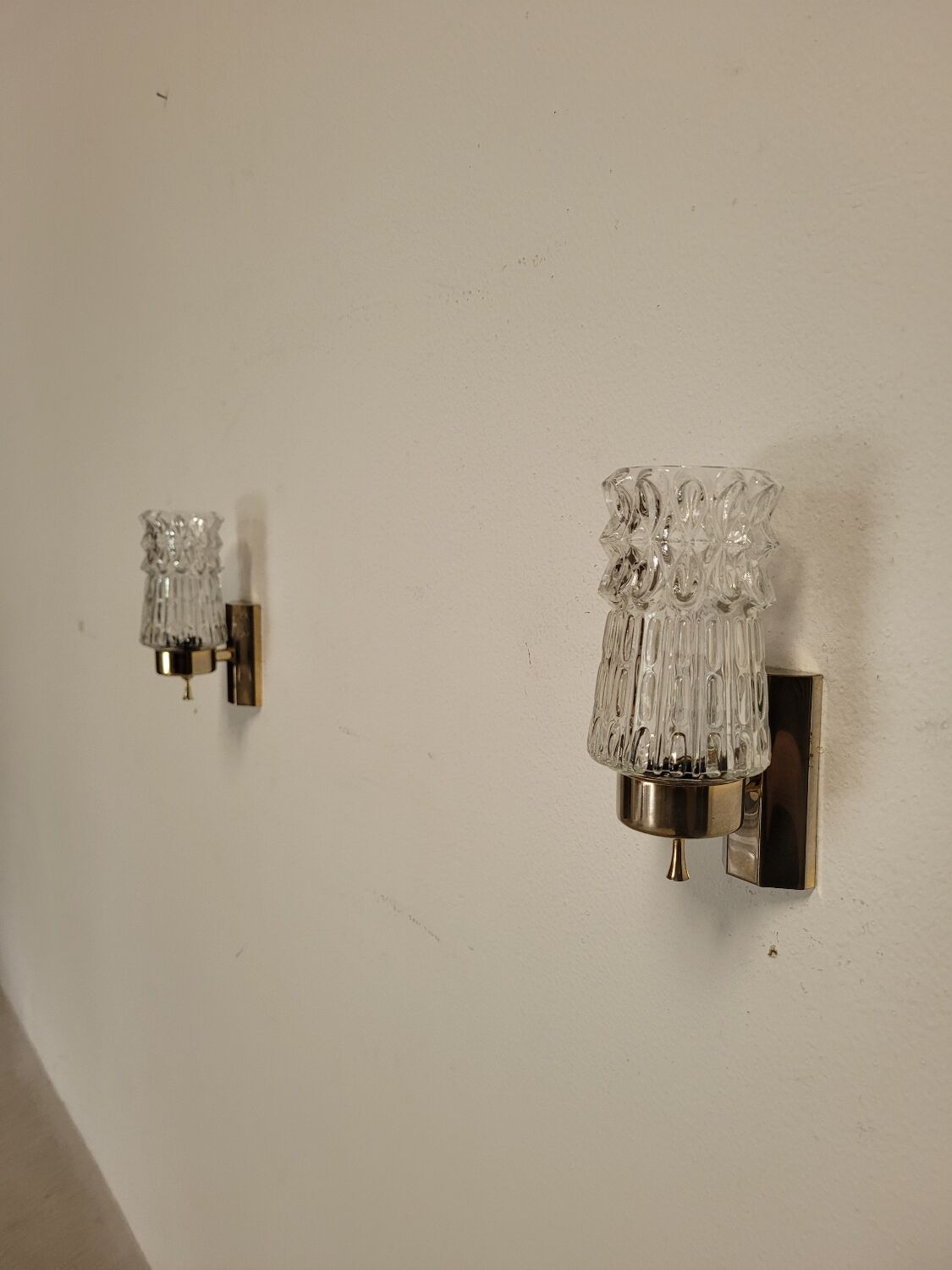 Pair of vintage brass and glass wall lights from the 1960s