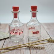 Oil and vinegar with red writing