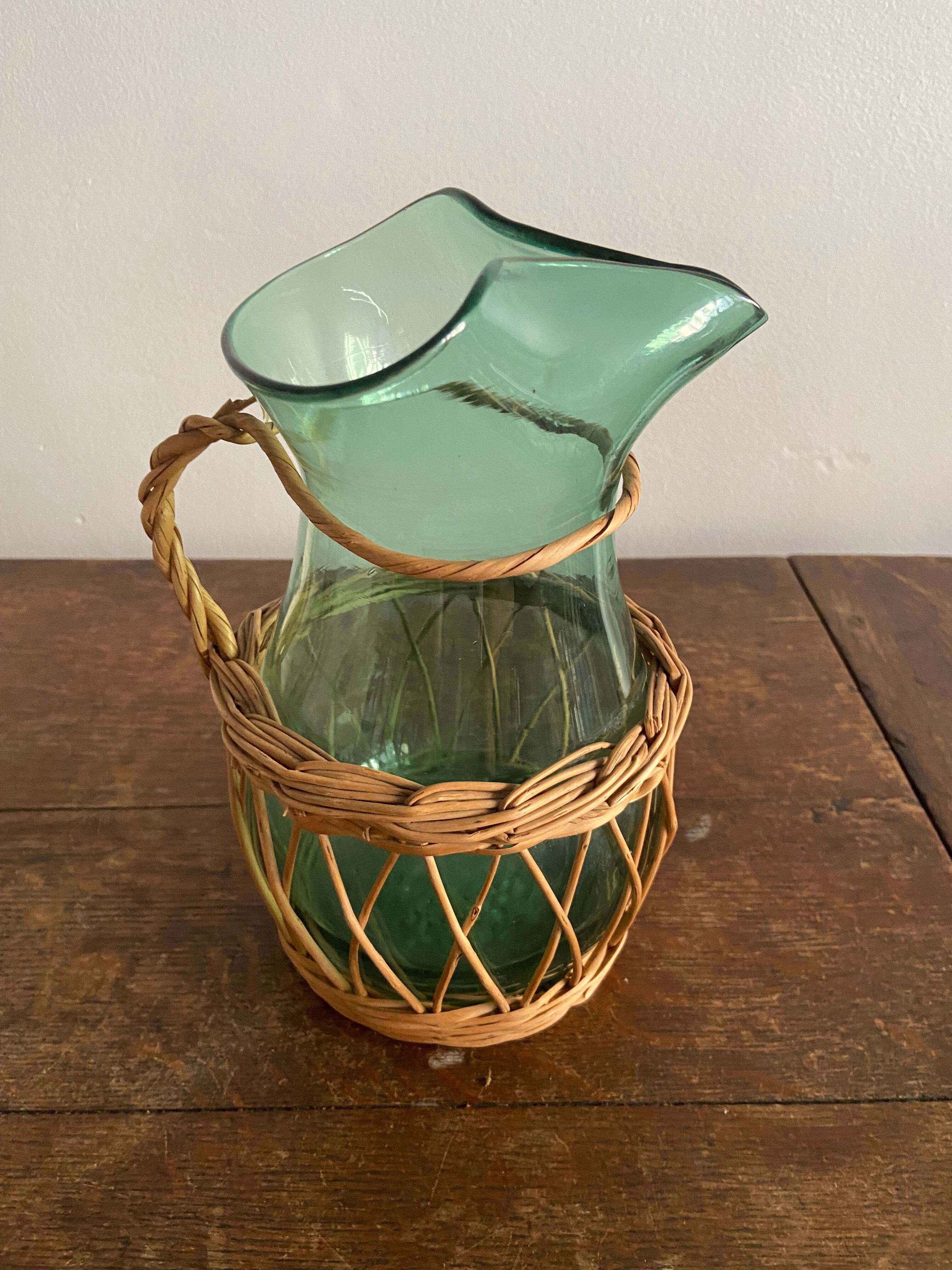 Glass pitcher and wicker