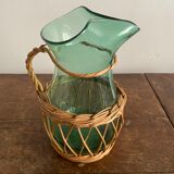 Glass pitcher and wicker