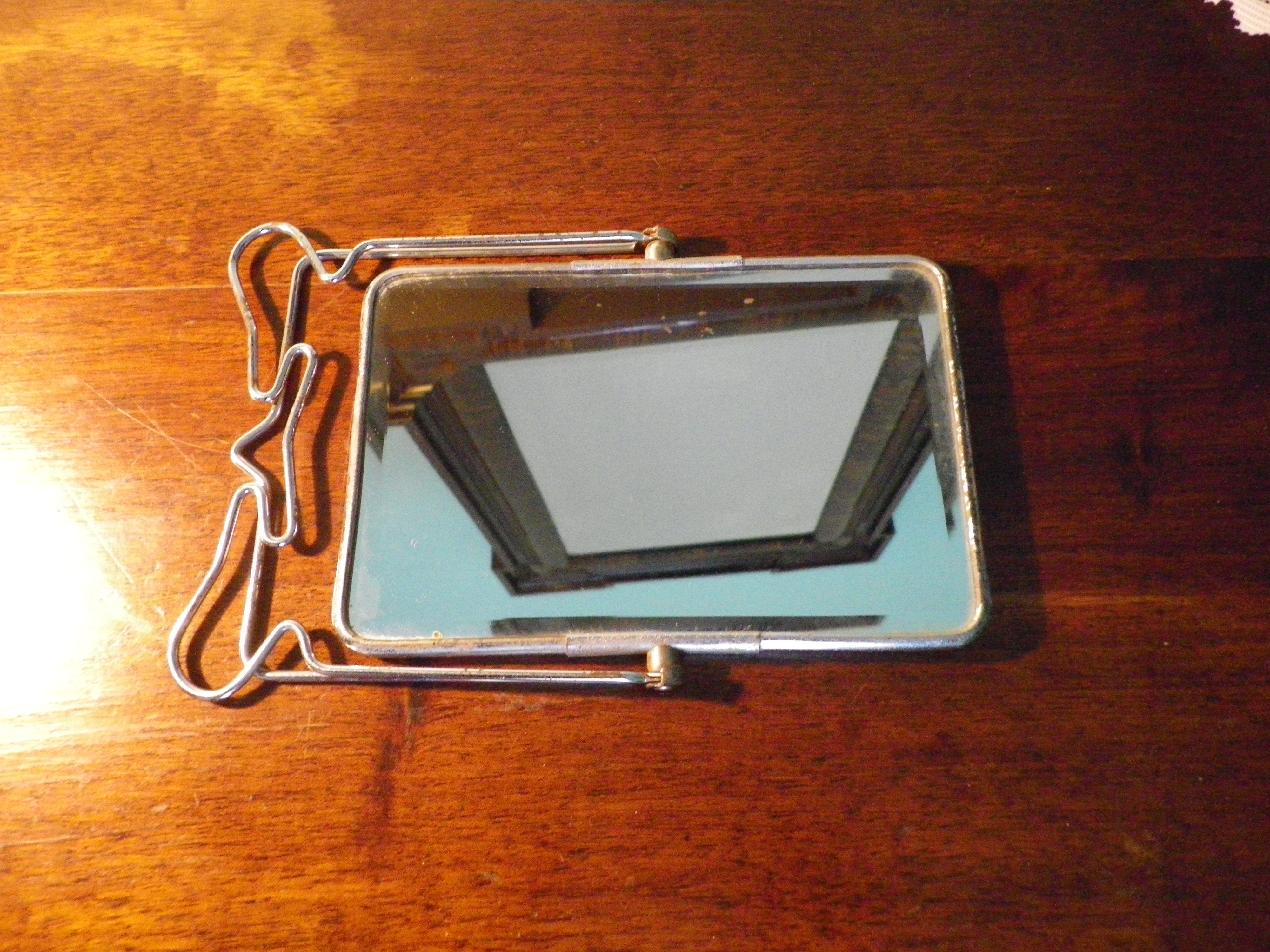 Two-foot barber mirror, suspension mode, beveled, chrome metal - 70s -