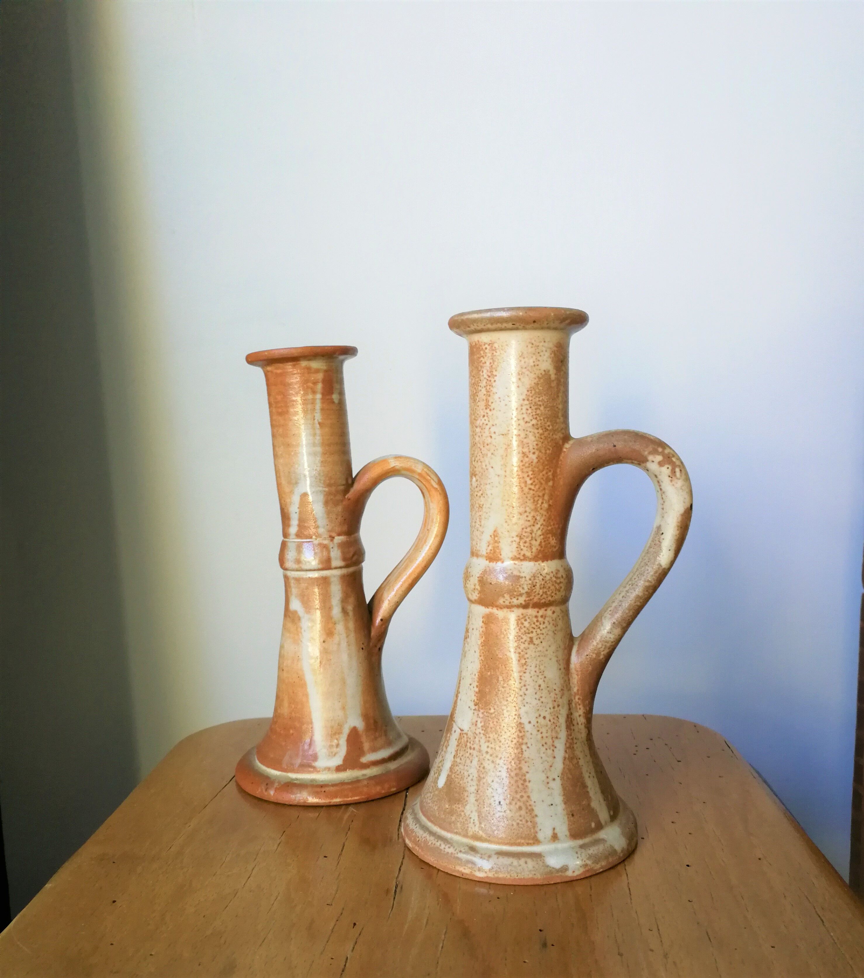 Pair of glazed stoneware candle holders