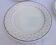 Set of 4 white and blue dinner plates.