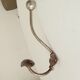 Antique steel wall-mounted coat rack
