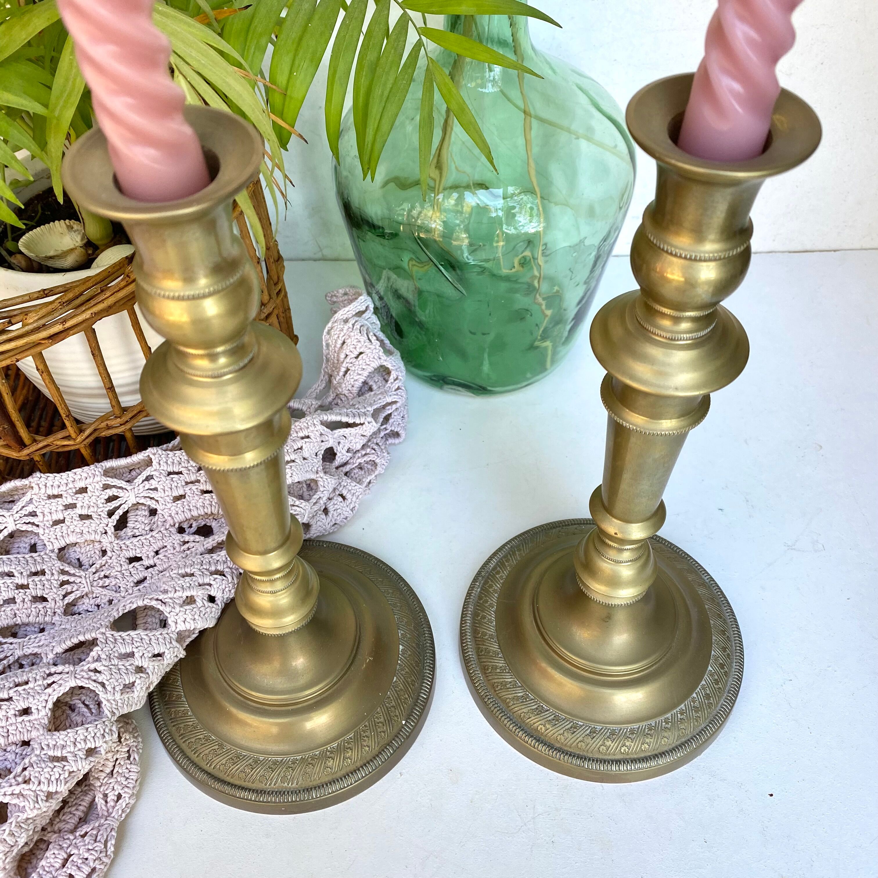 Pair of old candle holders in golden brass