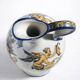 Gien earthenware jug, Renaissance decoration, putto with dolphin.