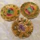 3 slip dessert plates stamped Sarreguemines. Fruit decor.