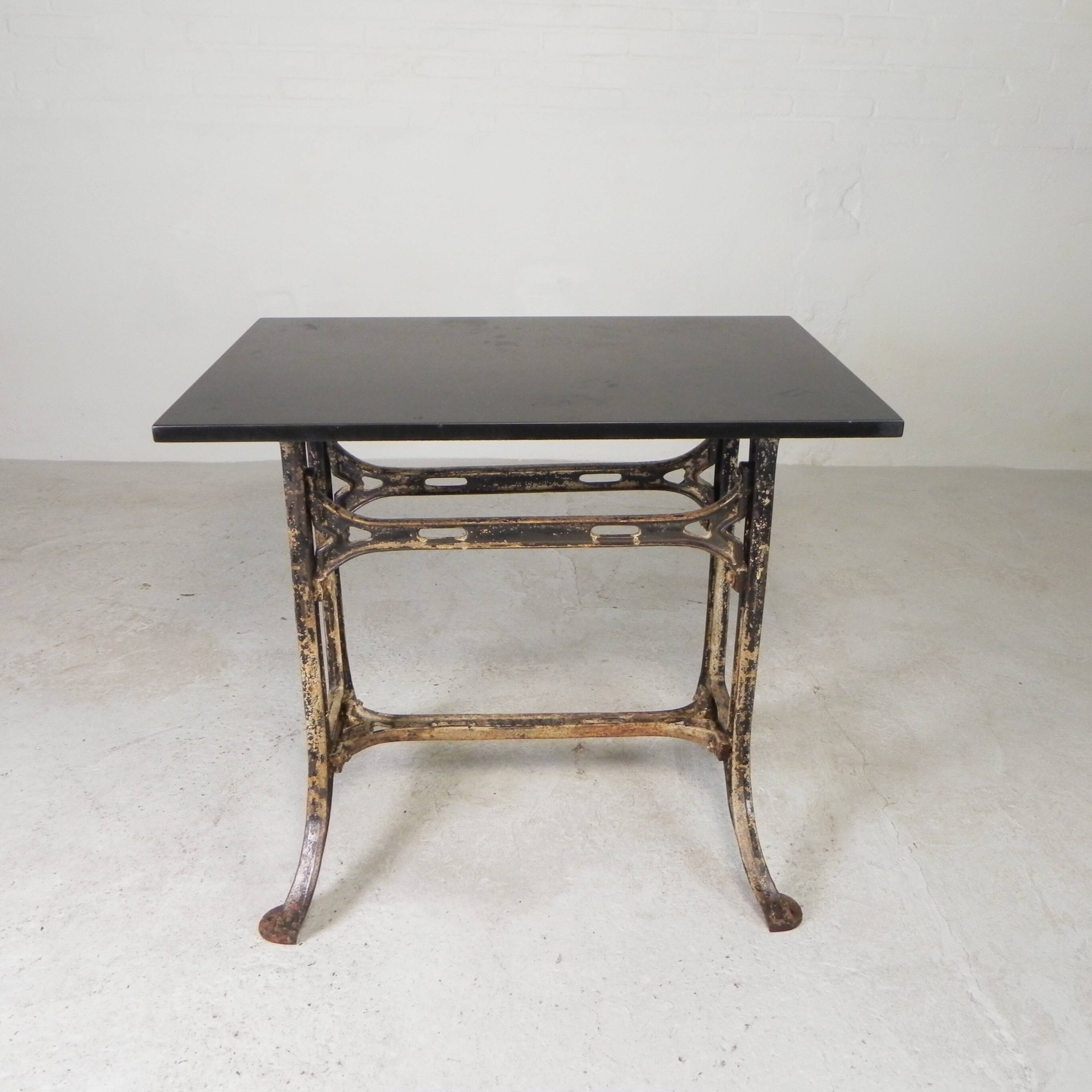 Industrial table, garden table with hard stone slab on cast iron frame, 1930s