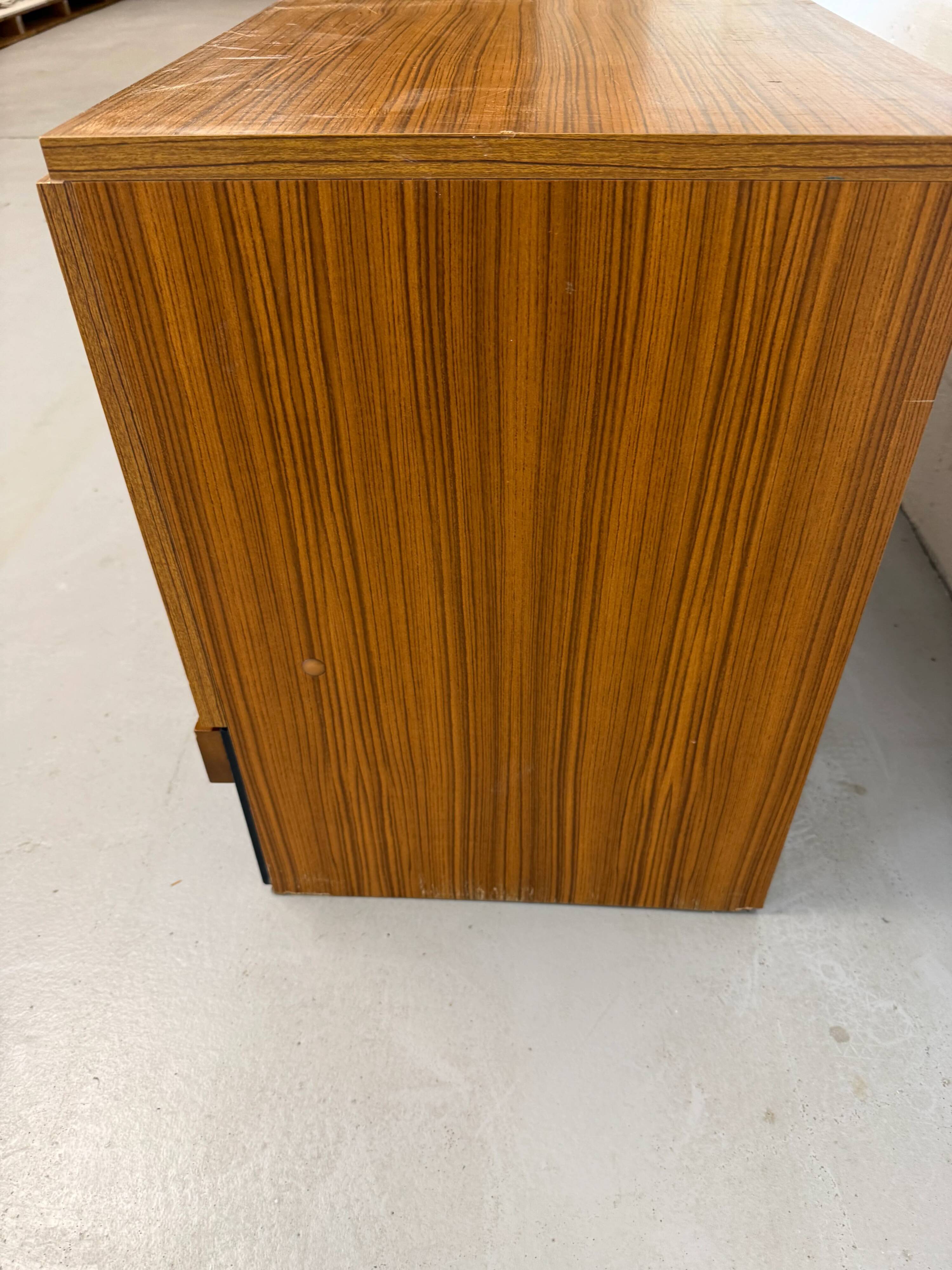 Vintage teak sideboard, mid-century style, with doors and drawers.