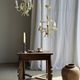 Small vintage cream metal flower chandelier with orange flowers and 3 arms.