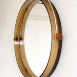 Space age round mirror with a smoked acrylic border