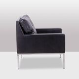 Pair of armchairs in black leather and chrome metal. 1970s.