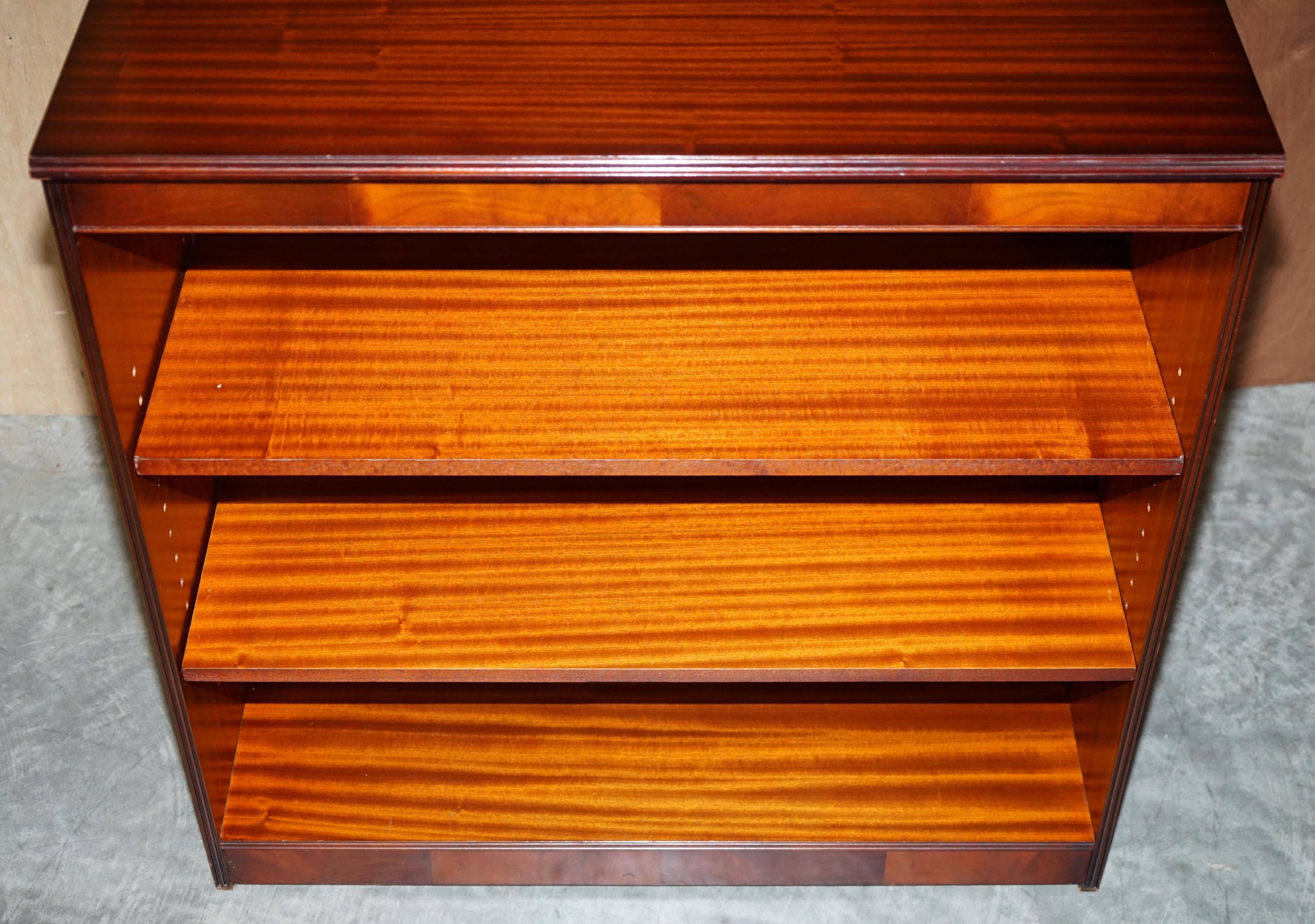 Pair of open low bookshelves Shaws of London in hardwood.