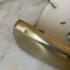 Shell-shaped wall light in Art Deco style with frosted glass and gilded bronze.
