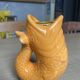 Orange fish candlestick